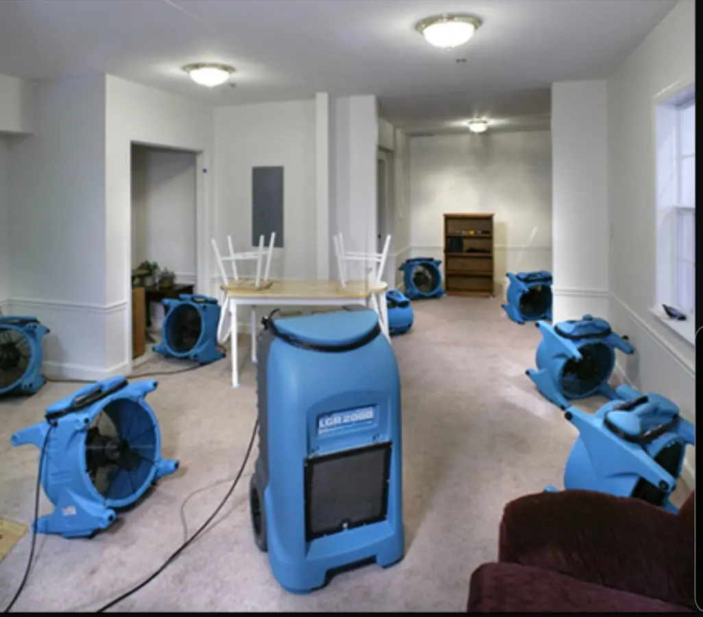 Air movers and dehumidifier setup for Water Damage Restoration in The Crossings